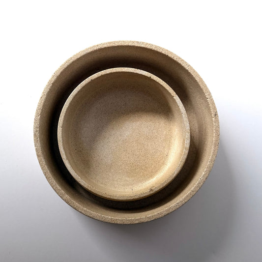 An overhead view of two handcrafted Dune Bowls, to highlight their shape and textured stone-inspired finish.
