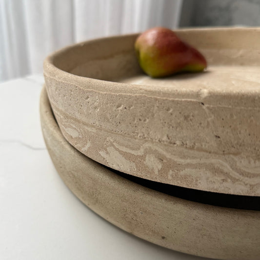 A close-up of stack of two handcrafted Terra Bowls highlighting their layered stone-inspired texture and handcrafted finish.